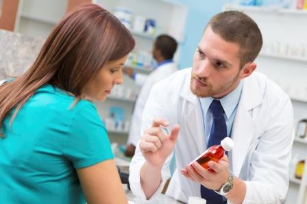 Pharmacist talks with patient