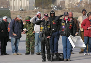 Homeless Veterans Salute the American Flag (Flag not shown) 
